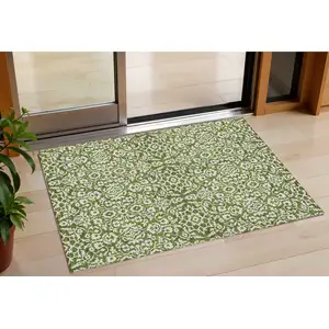 Photo of Olive Green And Ivory Damask Washable Indoor Outdoor Area Rug