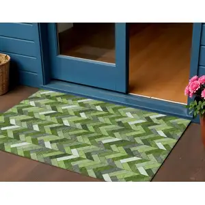 Photo of Olive Green And Ivory Geometric Washable Indoor Outdoor Area Rug