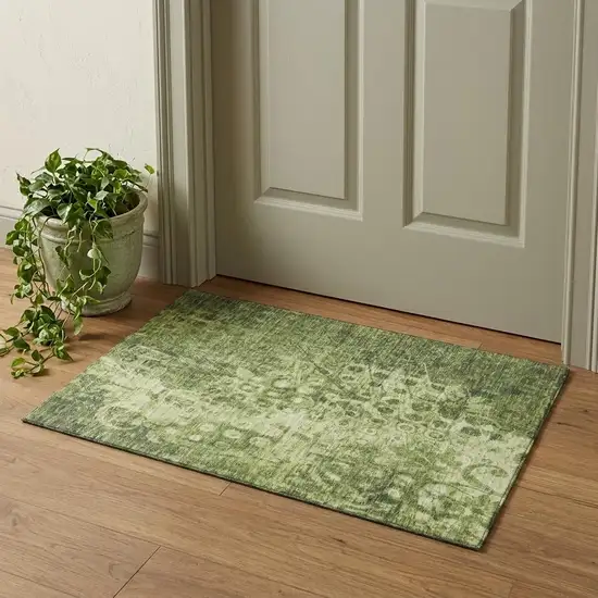 Olive Green And Ivory Ikat Washable Area Rug With UV Protection Photo 1
