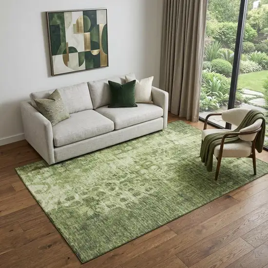 Olive Green And Ivory Ikat Washable Area Rug With UV Protection Photo 1