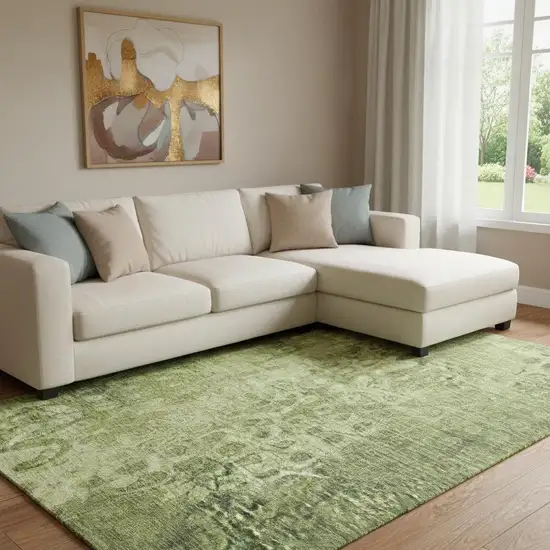 Olive Green And Ivory Ikat Washable Area Rug With UV Protection Photo 1