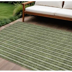 Photo of Olive Green And Ivory Striped Washable Indoor Outdoor Area Rug