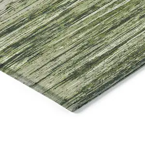 Photo of Olive Green And Ivory Striped Washable Indoor Outdoor Area Rug