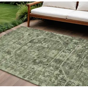 Photo of Olive Green And Ivory Tribal Washable Indoor Outdoor Area Rug