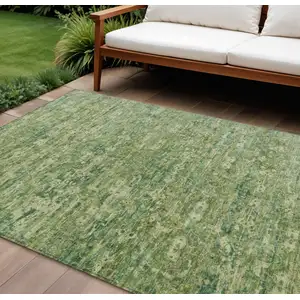 Photo of Olive Green And Sage Ikat Washable Indoor Outdoor Area Rug