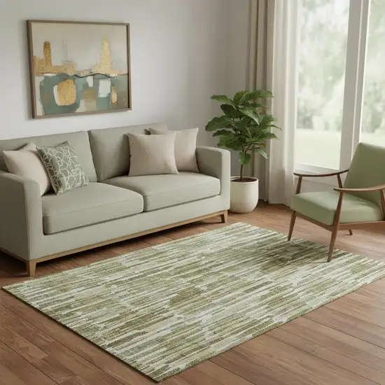 Olive Green Brown And Ivory Abstract Washable Area Rug With UV Protection Photo 1