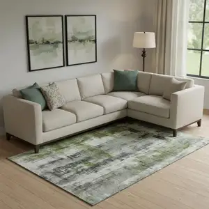 Photo of Olive Green Charcoal And Ivory Abstract Washable Area Rug With UV Protection