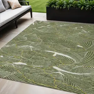 Photo of Olive Green Gold And Ivory Abstract Washable Indoor Outdoor Area Rug