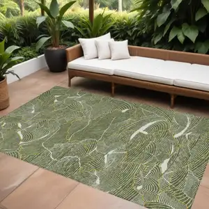 Photo of Olive Green Gold And Ivory Abstract Washable Indoor Outdoor Area Rug