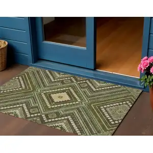 Photo of Olive Green Gray And Ivory Tribal Washable Indoor Outdoor Area Rug