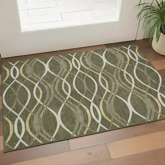 Olive Green Ivory And Gold Abstract Washable Area Rug With UV Protection Photo 1
