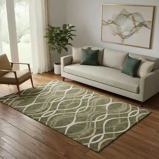 Olive Green Ivory And Gold Abstract Washable Area Rug With UV Protection Photo 1