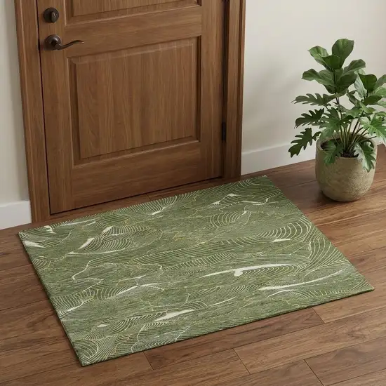 Olive Green Ivory And Gold Abstract Washable Area Rug With UV Protection Photo 1