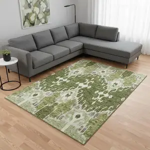 Photo of Olive Green Ivory And Gray Ikat Washable Area Rug With UV Protection