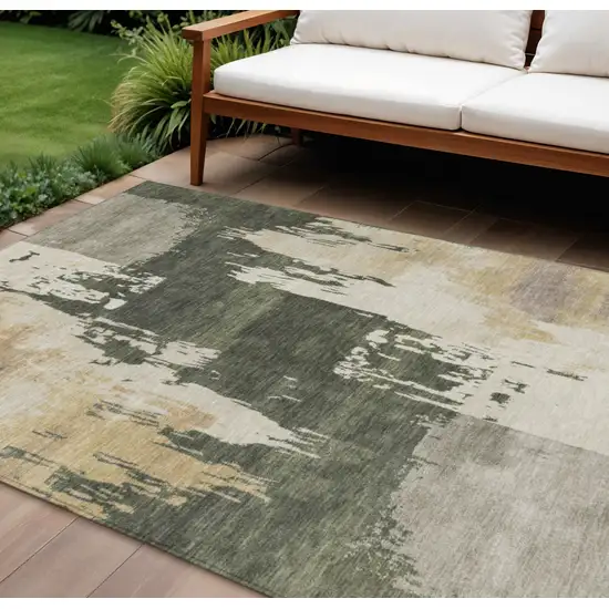Olive Green Ivory And Tan Abstract Washable Indoor Outdoor Area Rug Photo 1