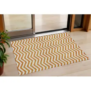 Photo of Orange And Beige Chevron Washable Indoor Outdoor Area Rug