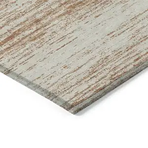 Photo of Orange And Beige Striped Washable Indoor Outdoor Area Rug