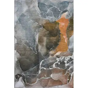Photo of Orange And Charcoal Abstract Washable Area Rug With UV Protection