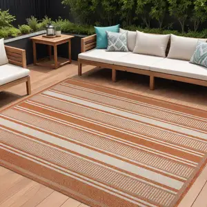Photo of Orange And Cream Striped Indoor Outdoor Area Rug