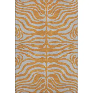 Photo of Orange And Gray Animal Print Washable Area Rug With UV Protection