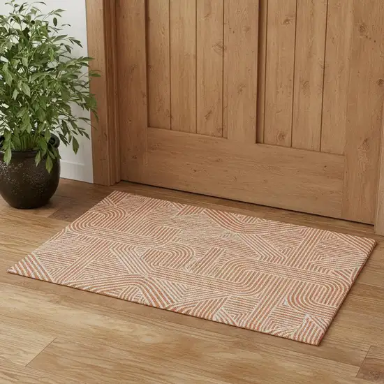 Orange And Ivory Abstract Geometric Washable Area Rug With UV Protection Photo 1
