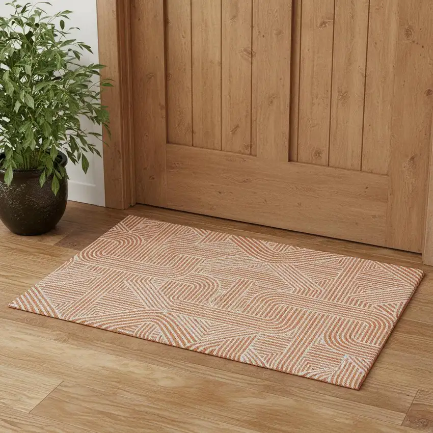 Orange And Ivory Abstract Geometric Washable Area Rug With UV Protection Photo 1