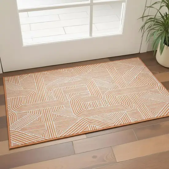 Orange And Ivory Abstract Geometric Washable Area Rug With UV Protection Photo 2