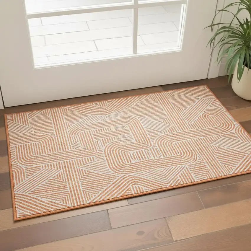 Orange And Ivory Abstract Geometric Washable Area Rug With UV Protection Photo 2