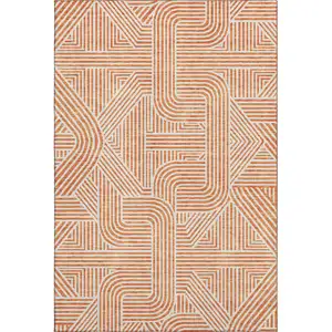 Photo of Orange And Ivory Abstract Geometric Washable Area Rug With UV Protection