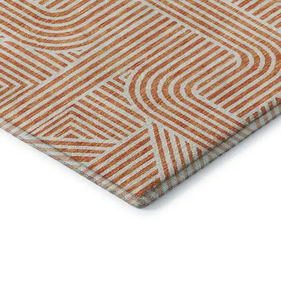 Orange And Ivory Abstract Geometric Washable Area Rug With UV Protection Photo 7