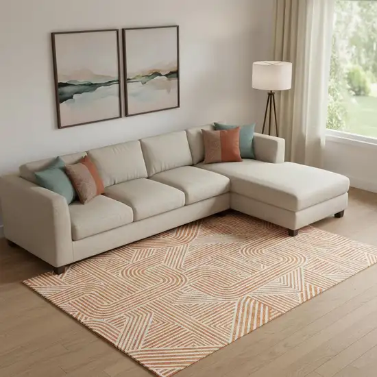 Orange And Ivory Abstract Geometric Washable Area Rug With UV Protection Photo 1