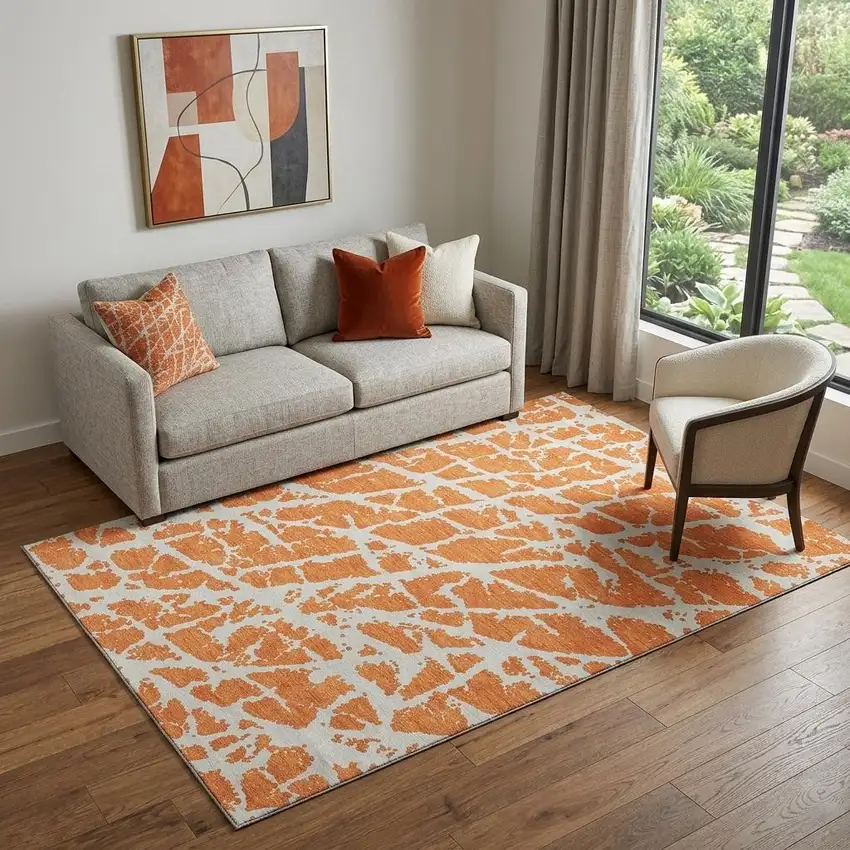 Orange And Ivory Abstract Washable Area Rug With UV Protection Photo 1