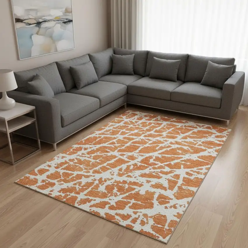 Orange And Ivory Abstract Washable Area Rug With UV Protection Photo 1