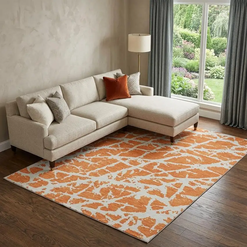 Orange And Ivory Abstract Washable Area Rug With UV Protection Photo 1