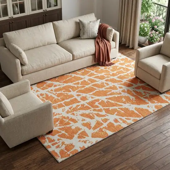 Orange And Ivory Abstract Washable Area Rug With UV Protection Photo 1