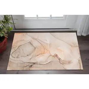 Photo of Orange And Ivory Abstract Washable Area Rug With UV Protection