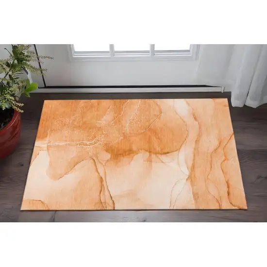 Orange And Ivory Abstract Washable Area Rug With UV Protection Photo 2