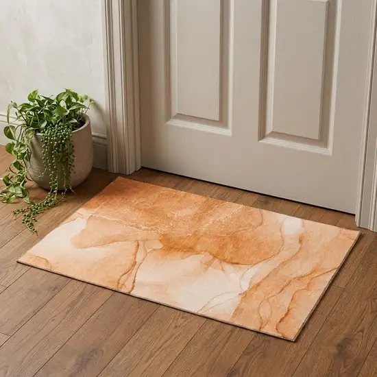 Orange And Ivory Abstract Washable Area Rug With UV Protection Photo 1