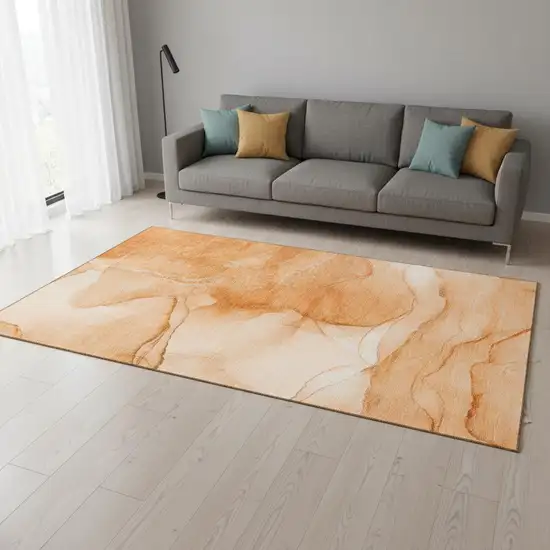 Orange And Ivory Abstract Washable Area Rug With UV Protection Photo 1
