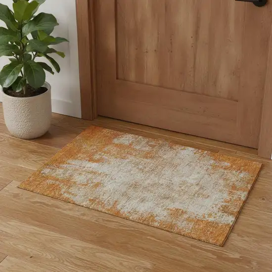 Orange And Ivory Abstract Washable Area Rug With UV Protection Photo 2