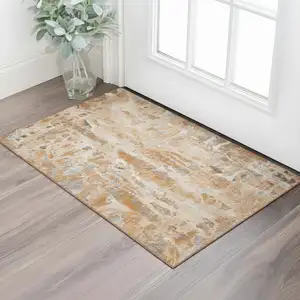 Photo of Orange And Ivory Abstract Washable Area Rug With UV Protection
