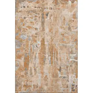 Photo of Orange And Ivory Abstract Washable Area Rug With UV Protection