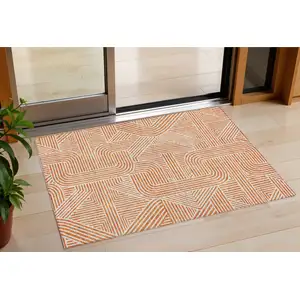 Photo of Orange And Ivory Abstract Washable Indoor Outdoor Area Rug