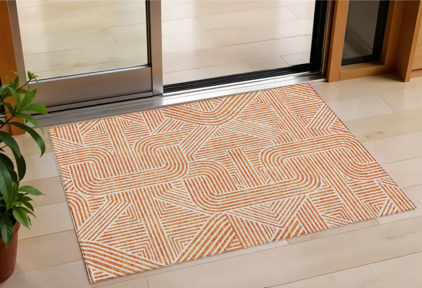 Orange And Ivory Abstract Washable Indoor Outdoor Area Rug Photo 1