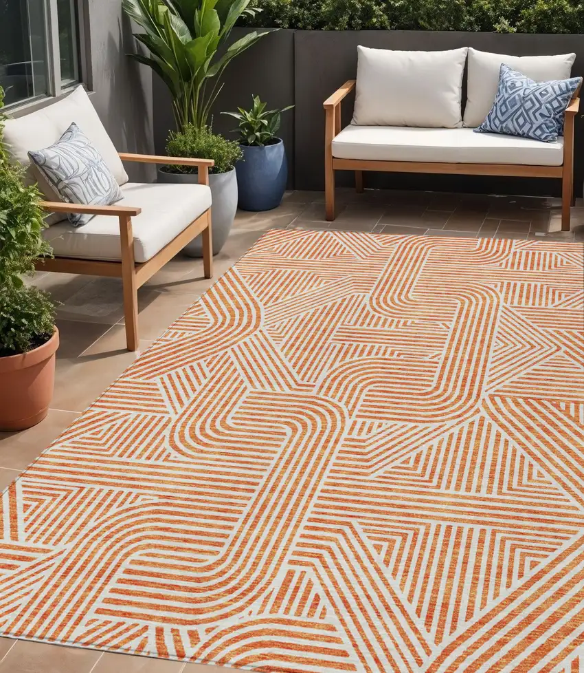Orange And Ivory Abstract Washable Indoor Outdoor Area Rug Photo 1