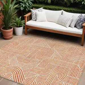 Photo of Orange And Ivory Abstract Washable Indoor Outdoor Area Rug