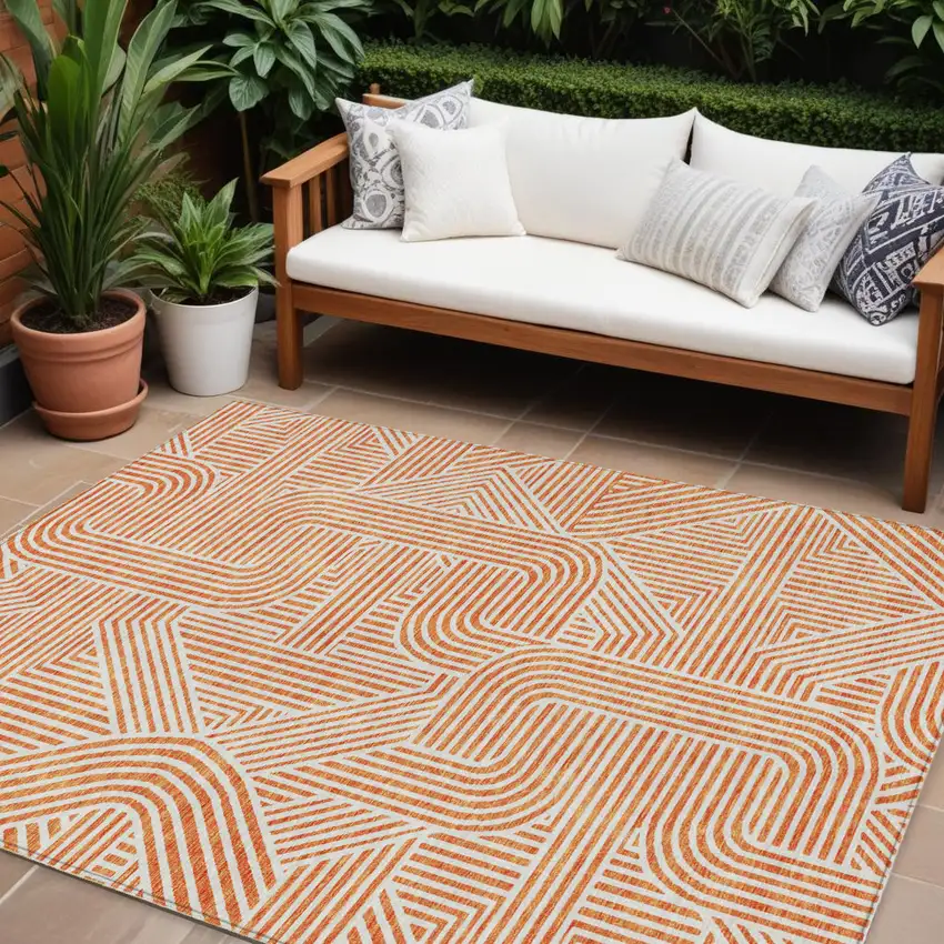 Orange And Ivory Abstract Washable Indoor Outdoor Area Rug Photo 1