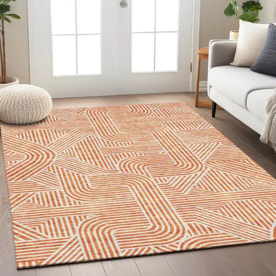 Orange And Ivory Abstract Washable Indoor Outdoor Area Rug Photo 9