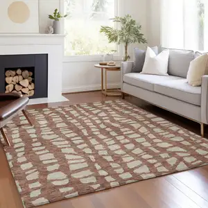 Photo of Orange And Ivory Abstract Washable Indoor Outdoor Area Rug