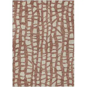 Photo of Orange And Ivory Abstract Washable Indoor Outdoor Area Rug